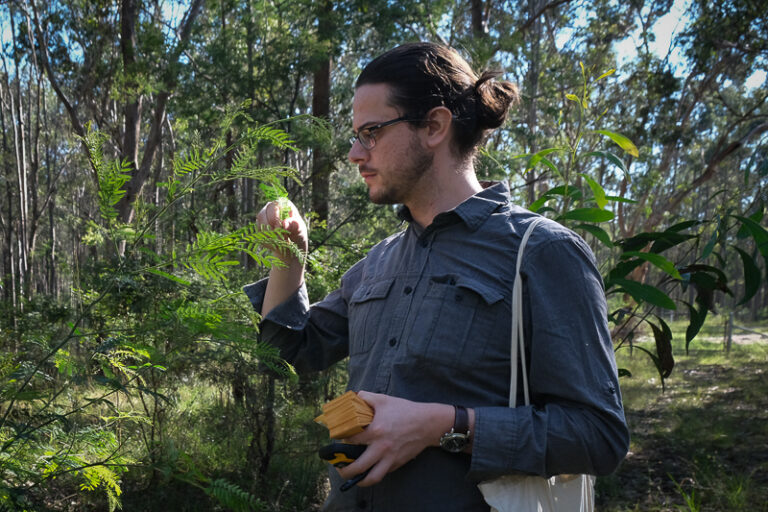 patrick Fahey Collecting plant specimens in the field.